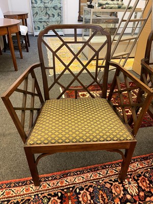 Lot 66 - A set of four George III-style mahogany 'cockpen' elbow chairs