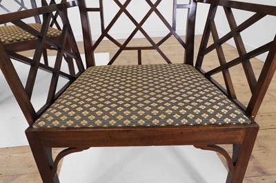 Lot 66 - A set of four George III-style mahogany 'cockpen' elbow chairs
