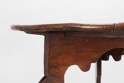 Lot 56 - A George III elm cricket table