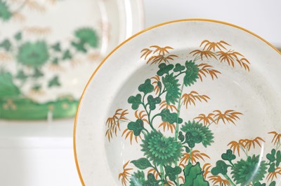 Lot 413 - A glazed earthenware 'Bamboo and Rock' part-service
