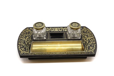 Lot 193 - A brasswork and ebony inkstand