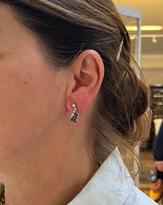 Lot 136 - A pair of 18ct white gold diamond and sapphire drop earrings
