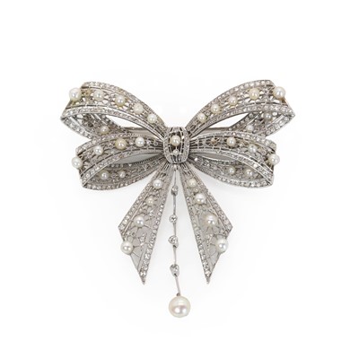 Lot 54 - A diamond and pearl ribbon bow brooch, c.1915