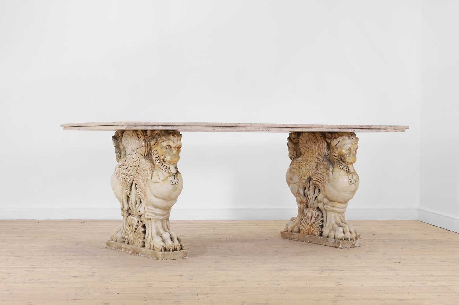 Lot 53 - A marble and travertine console table after the antique