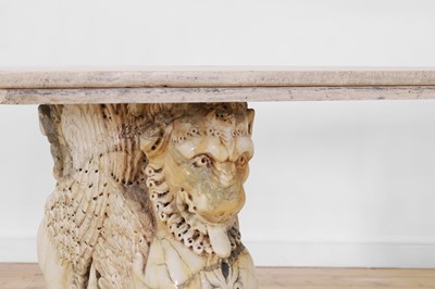 Lot 53 - A marble and travertine console table after the antique