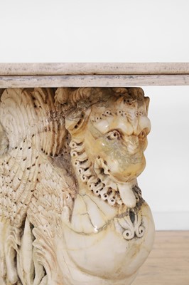 Lot 53 - A marble and travertine console table after the antique