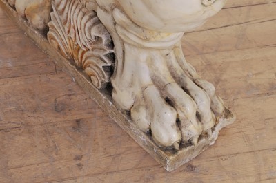 Lot 53 - A marble and travertine console table after the antique