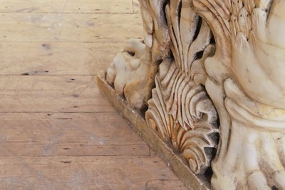 Lot 53 - A marble and travertine console table after the antique