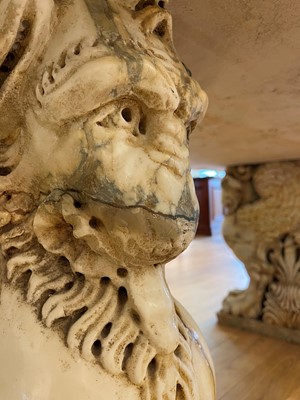 Lot 53 - A marble and travertine console table after the antique
