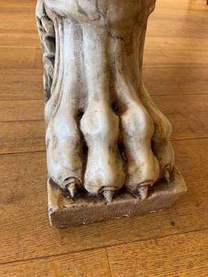 Lot 53 - A marble and travertine console table after the antique