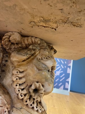 Lot 53 - A marble and travertine console table after the antique