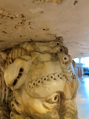 Lot 53 - A marble and travertine console table after the antique