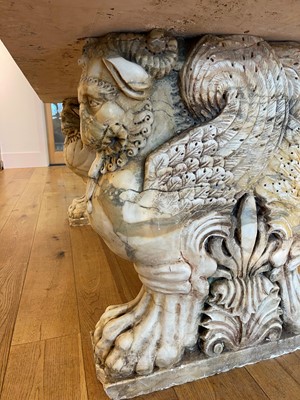 Lot 53 - A marble and travertine console table after the antique