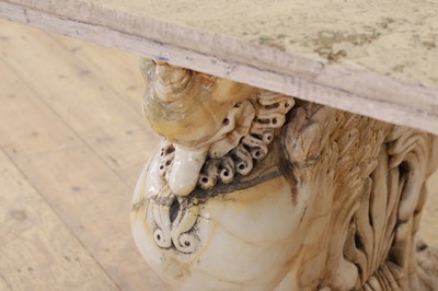 Lot 53 - A marble and travertine console table after the antique