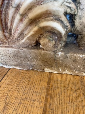 Lot 53 - A marble and travertine console table after the antique