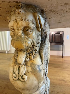 Lot 53 - A marble and travertine console table after the antique