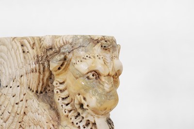 Lot 53 - A marble and travertine console table after the antique