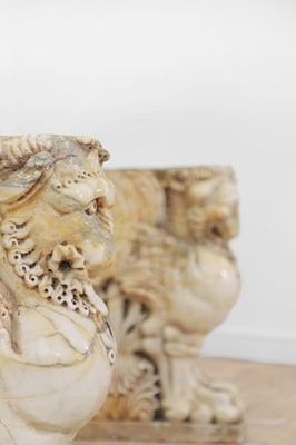 Lot 53 - A marble and travertine console table after the antique