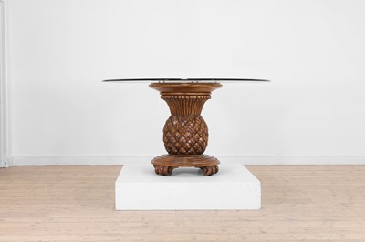 Lot 351 - A carved beech and glass dining table