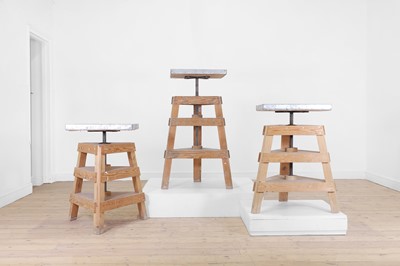 Lot 80 - A set of three pine and metal pottery stands