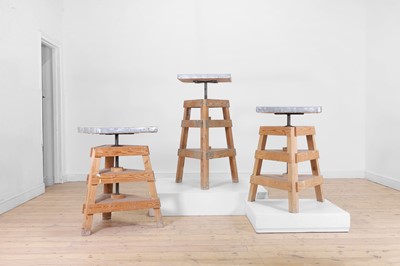 Lot 80 - A set of three pine and metal pottery stands