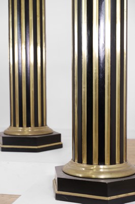 Lot 161 - A pair of ebonised and parcel-gilt wooden columns
