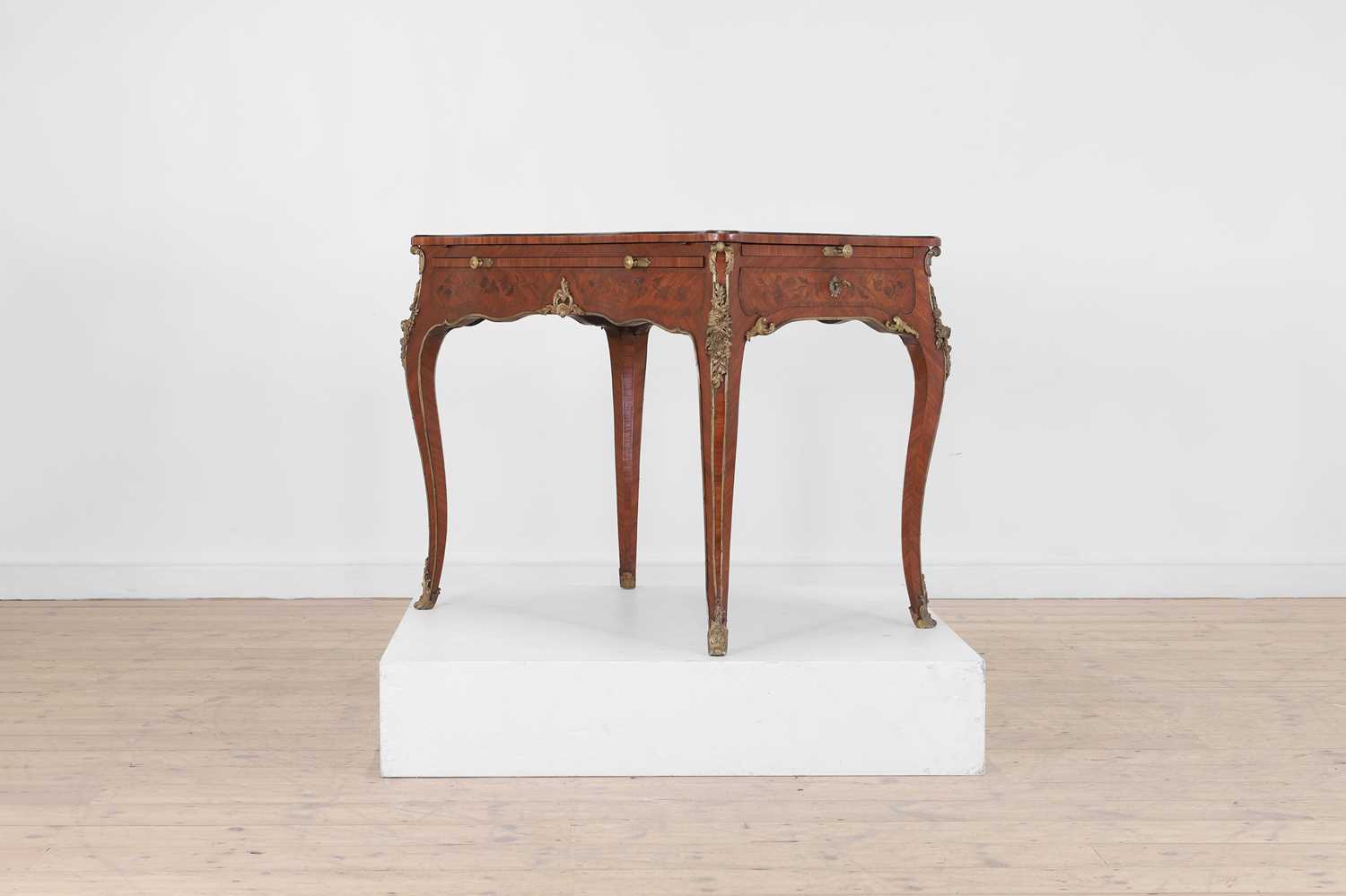 Lot 27 - A Louis XV-style kingwood and tulipwood marquetry bureau plat