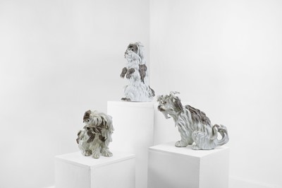 Lot 409 - Three Meissen-style porcelain Bolognese dogs