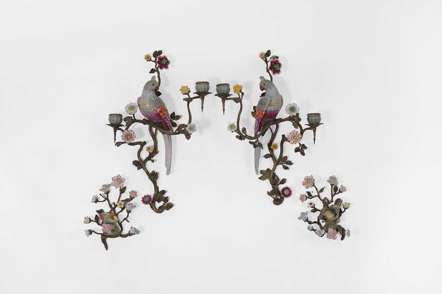 Lot 105 - A pair of porcelain and ormolu wall lights