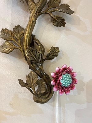 Lot 105 - A pair of porcelain and ormolu wall lights