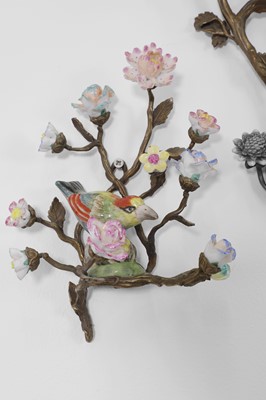 Lot 105 - A pair of porcelain and ormolu wall lights
