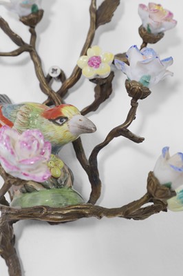Lot 105 - A pair of porcelain and ormolu wall lights