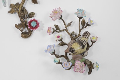Lot 105 - A pair of porcelain and ormolu wall lights