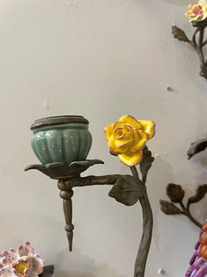 Lot 105 - A pair of porcelain and ormolu wall lights