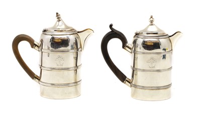 Lot 1 - Two silver hot water jugs