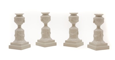 Lot 99 - A set of four Royal Copenhagen porcelain candlesticks