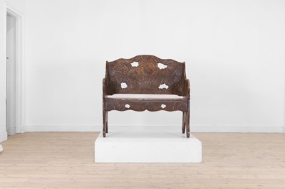 Lot 218 - A carved beech bench for Liberty of London