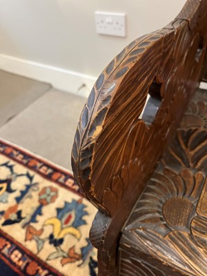 Lot 218 - A carved beech bench for Liberty of London