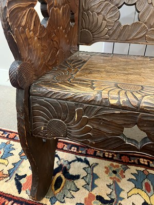 Lot 218 - A carved beech bench for Liberty of London