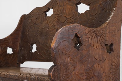 Lot 218 - A carved beech bench for Liberty of London