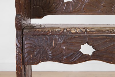 Lot 218 - A carved beech bench for Liberty of London