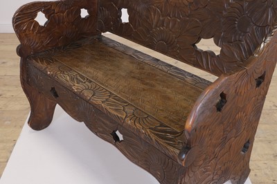 Lot 218 - A carved beech bench for Liberty of London