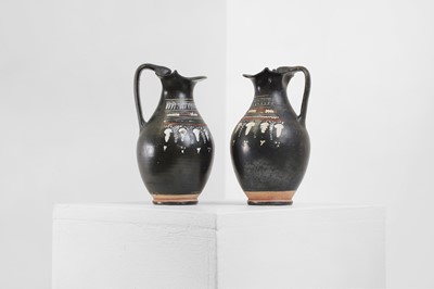 Lot 89 - A near pair of Apulian Gnathian ware pottery oinochoai