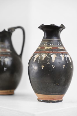 Lot 89 - A near pair of Apulian Gnathian ware pottery oinochoai