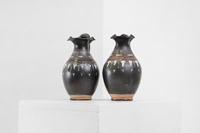 Lot 89 - A near pair of Apulian Gnathian ware pottery oinochoai