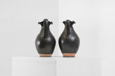 Lot 89 - A near pair of Apulian Gnathian ware pottery oinochoai