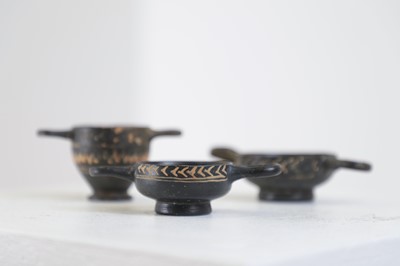Lot 103 - A group of three Gnathian ware miniature pottery vessels