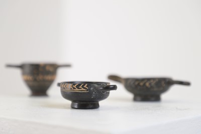 Lot 103 - A group of three Gnathian ware miniature pottery vessels