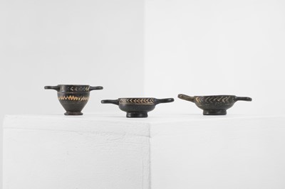 Lot 103 - A group of three Gnathian ware miniature pottery vessels