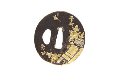 Lot 90 - A Japanese iron and gold tsuba